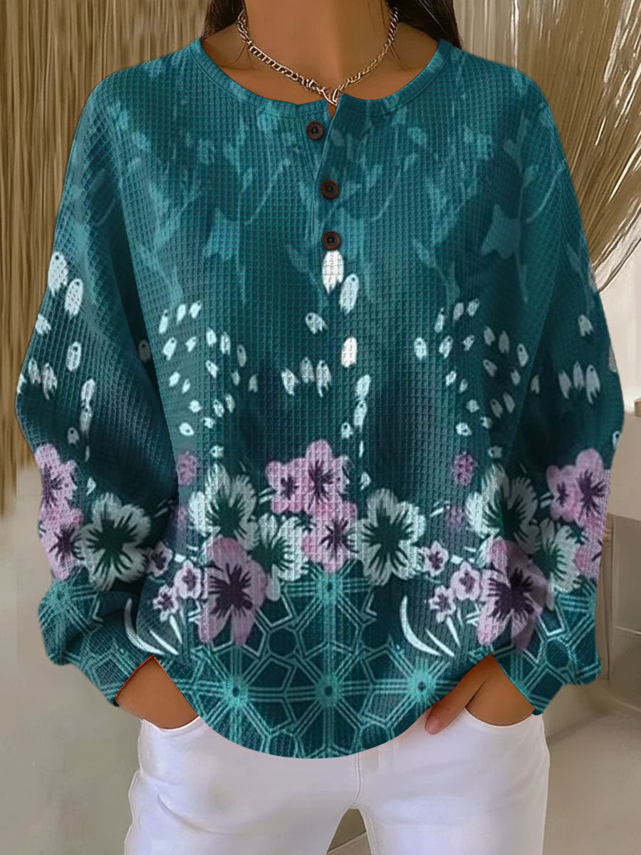 Liselot | Turquoise trui met bloesems